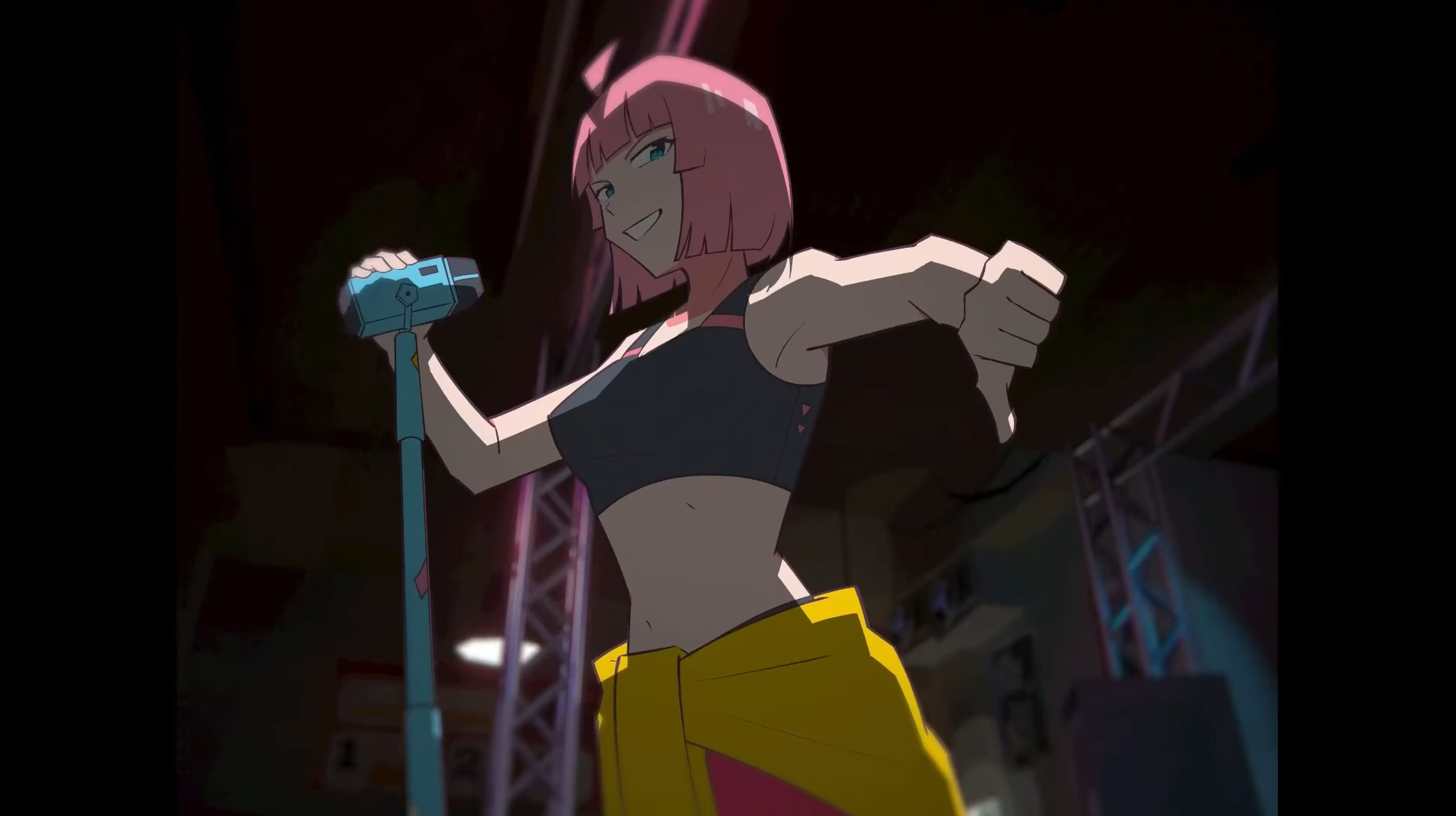 Beat, a pink haired woman with a yellow hoodie around her waist, holds a microphone and gives a thumbs down with a smile on her face.